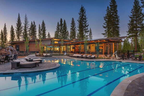 Relax by the resort pool surrounded by tall trees and enjoy the view from the adjacent building.