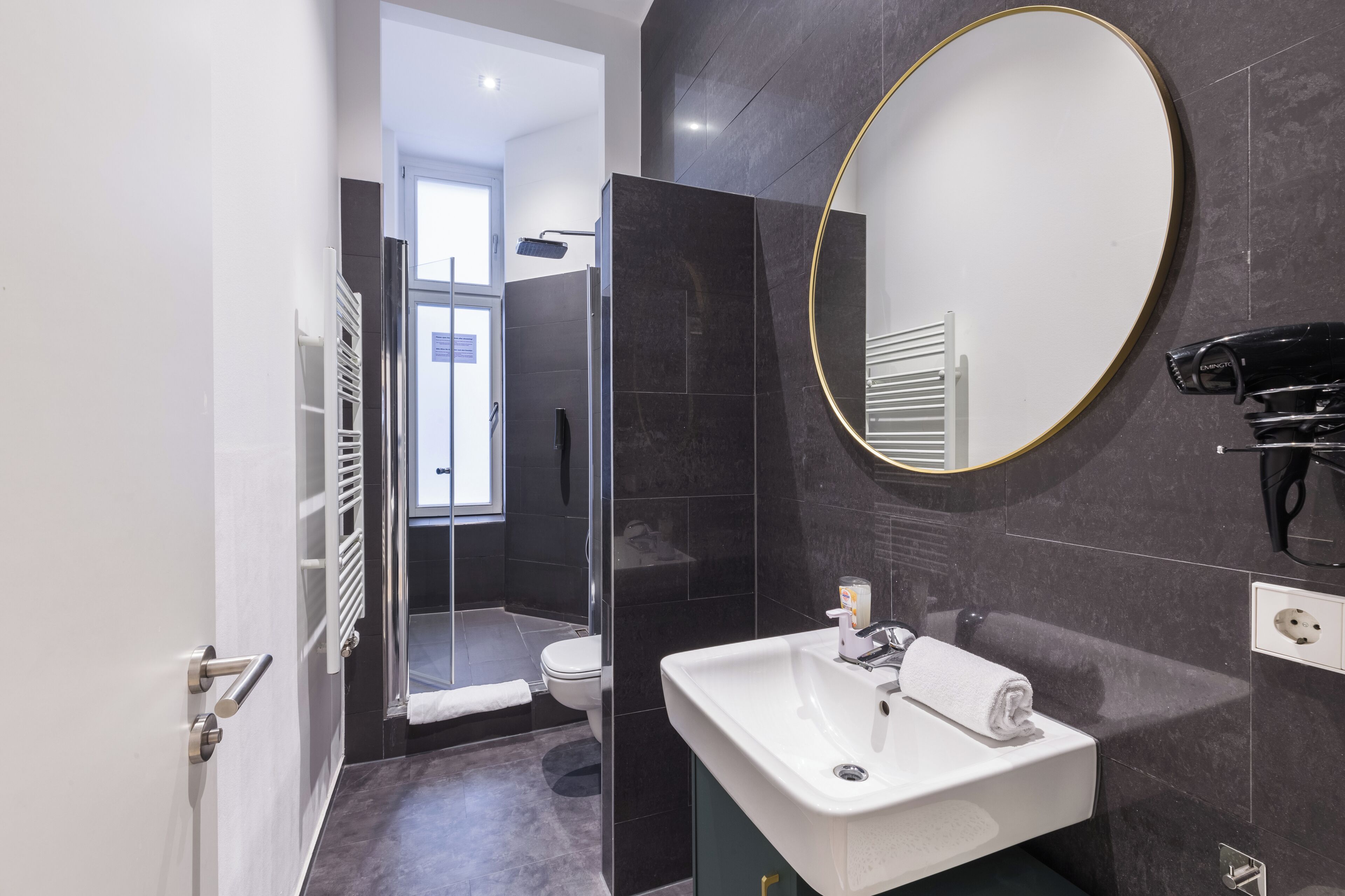 Shower, hair dryer, towels, soap