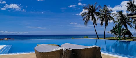 Outdoor pool, pool umbrellas, sun loungers