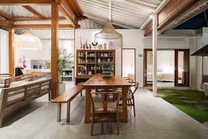 Cozy living space with a dining table, seating area, and bookshelf.