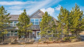 A two-story house with a visible front entrance and a mailbox. - Pacific Paradise-Comfortable, cute home near beach (Pacific City)