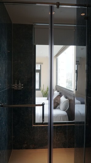 Deluxe Double or Twin Room | Bathroom | Shower, rainfall showerhead, hair dryer, slippers - Bros Hotel (Ho Chi Minh City)