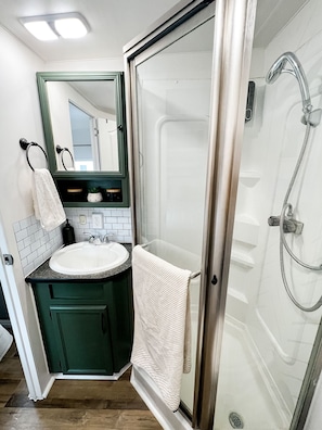 Shower, hair dryer, towels, soap