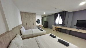 A hotel room with two beds, a desk, a television, and a large window with curtains. - All day hostel @ BTS Bang Chak (Bangkok)