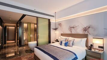 Premium bedding, down duvets, memory-foam beds, in-room safe