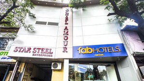 A hotel facade with signage for "Star Steel Enterprises" and "FabHotels". - Fabhotel Amour (Mumbai)