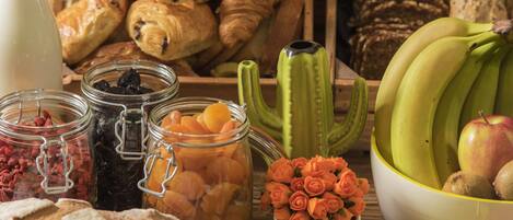 A variety of food items including pastries, fruits, and preserved goods.