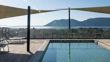 Outdoor pool, open 9:00 AM to 9:00 PM, pool umbrellas, sun loungers