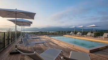 Outdoor pool, open 9:00 AM to 9:00 PM, pool umbrellas, sun loungers