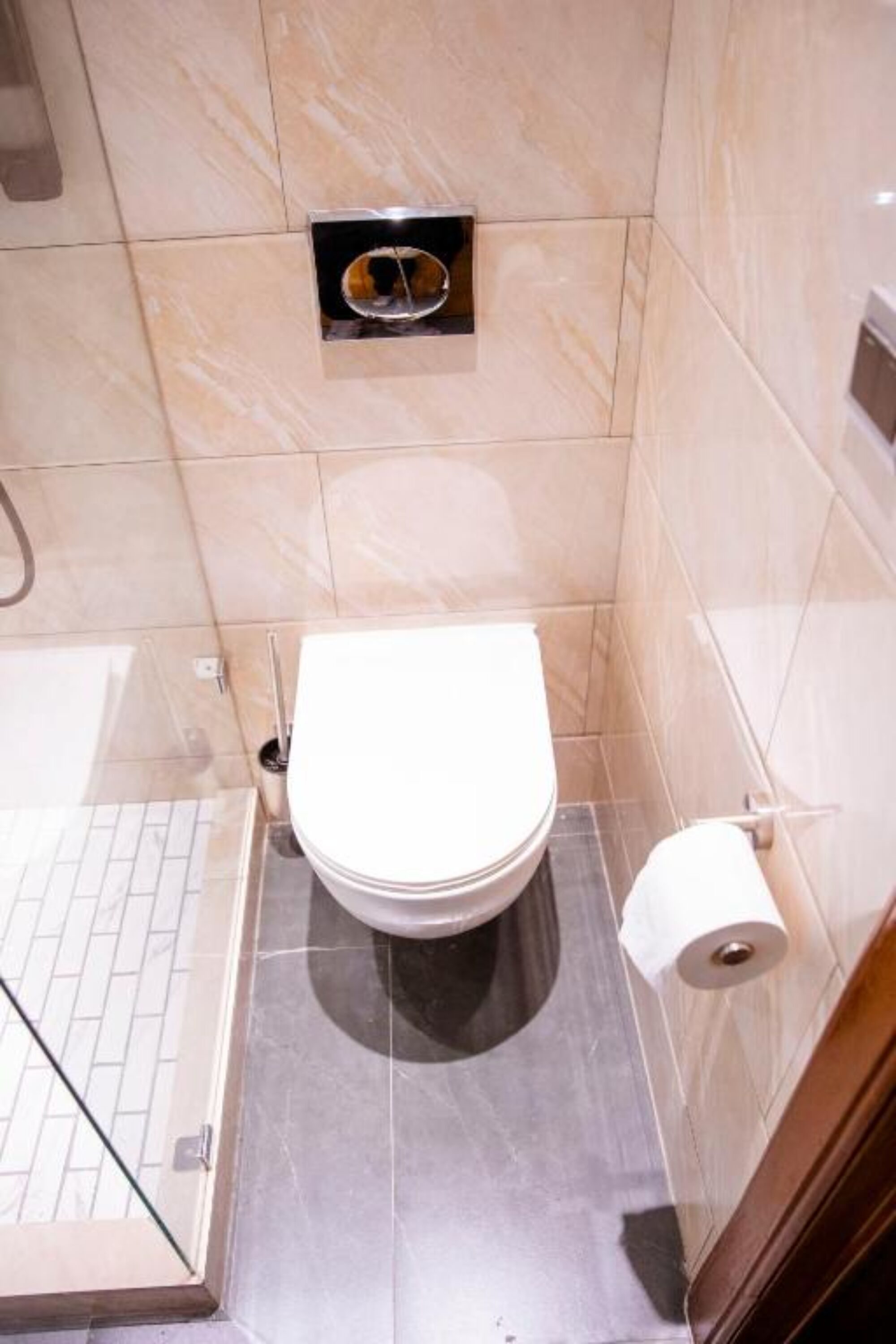 A bathroom with a toilet, a bidet, and a shower area.