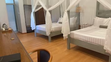 Chambre Quadruple Deluxe | Coffres-forts dans les chambres, décoration personnalisée