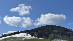 A mountainous landscape with a clear sky and scattered clouds. - Recreation resort for Black Forest fans (Horben)