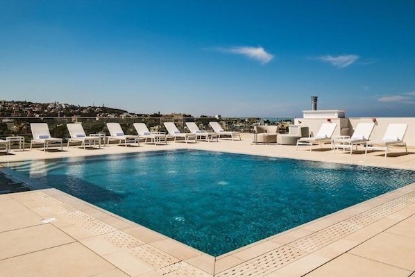Indoor pool, outdoor pool, pool umbrellas, sun loungers