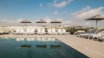 Indoor pool, outdoor pool, pool umbrellas, pool loungers