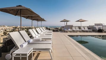 Indoor pool, outdoor pool, pool umbrellas, sun loungers