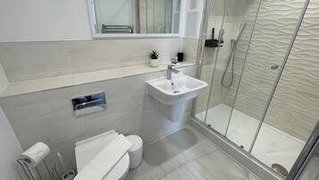 Shower, hair dryer, towels