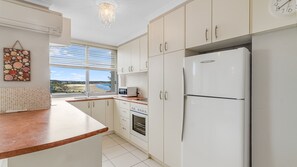 Fridge, microwave, stovetop, cookware/dishes/utensils