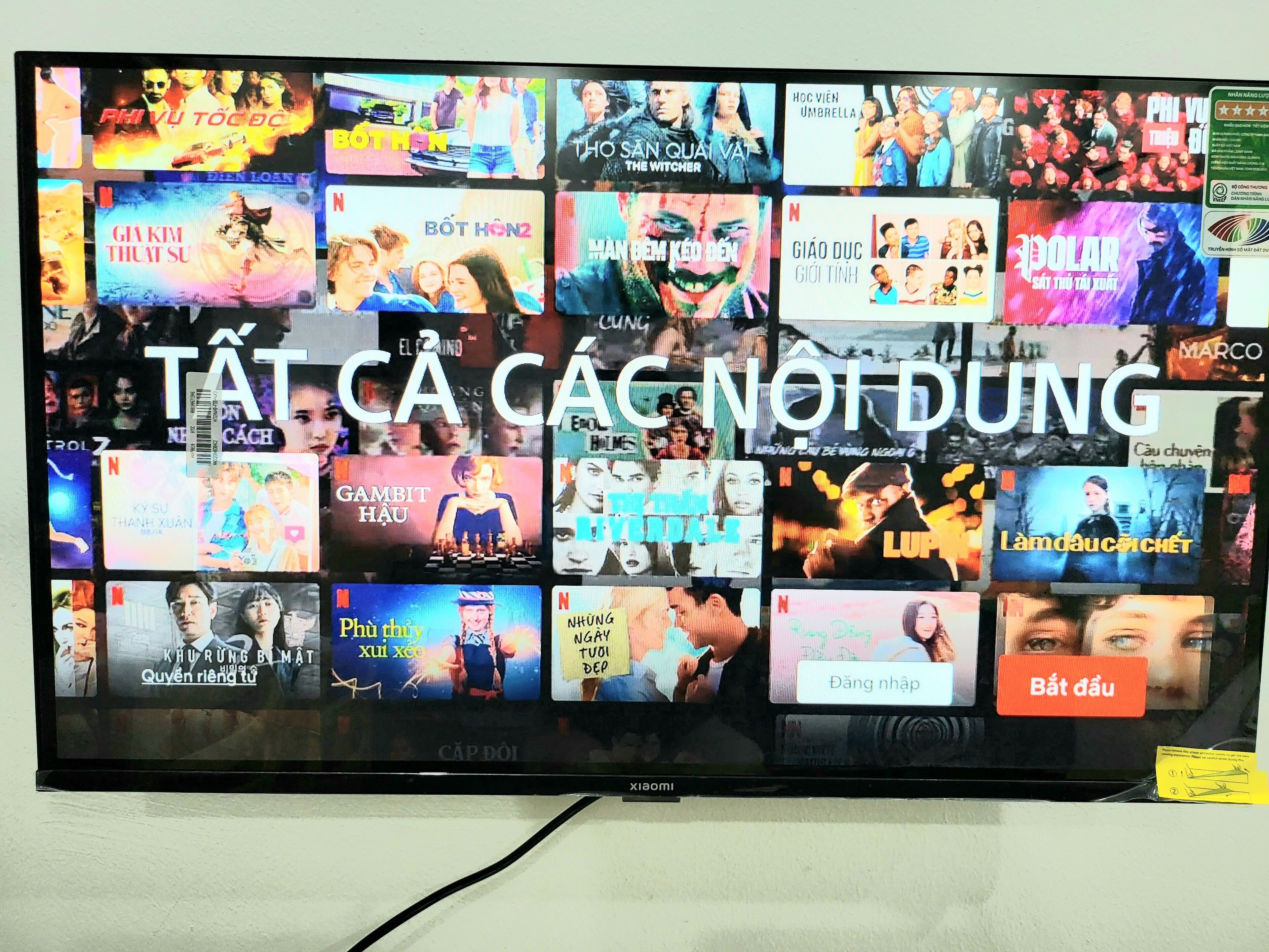 A television displaying a variety of movie and TV show thumbnails.