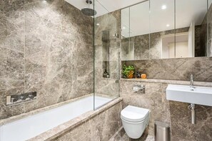 Bathtub, hair dryer, towels