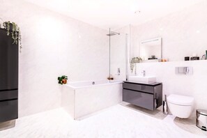 Bathtub, hair dryer, towels