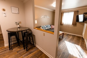 Family Suite, 1 King Bed with Sofa bed | Living area | 32-inch flat-screen TV with cable channels, TV - Woodland Motel (Salida)