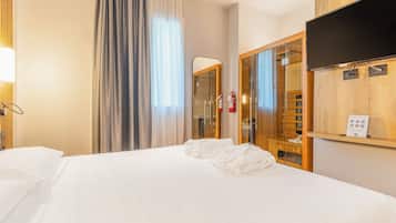 Een kluis op de kamer, geluiddichte muren, een strijkplank/strijkijzer