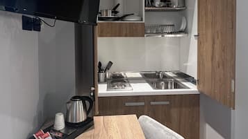Family con cucina | Een minibar, een kluis op de kamer, geluiddichte muren, babybedden