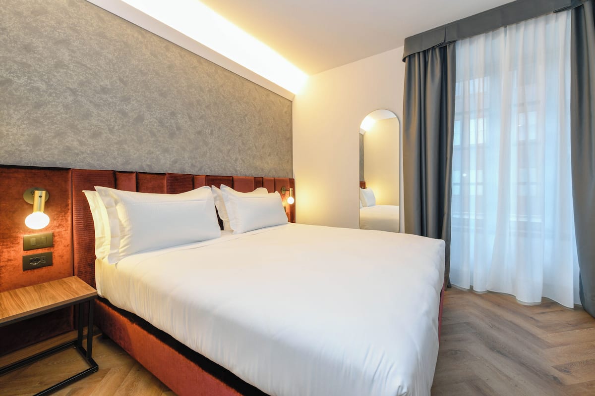 1 slaapkamer, donzen dekbedden, een minibar, een kluis op de kamer