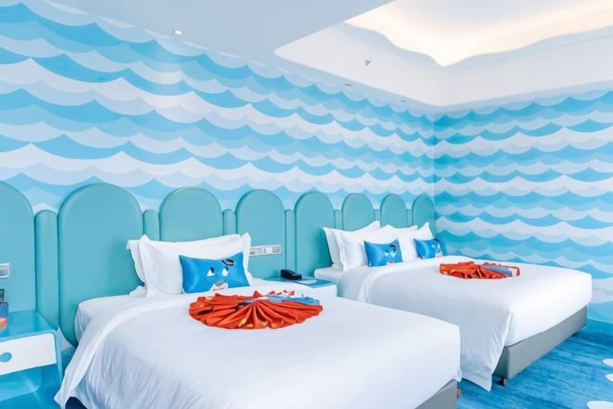 A hotel room with two beds, a wave-patterned wall, and a modern design.
