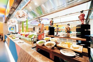 A buffet with various food items and traditional decorations.