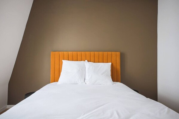 1 bedroom, desk, iron/ironing board, travel crib