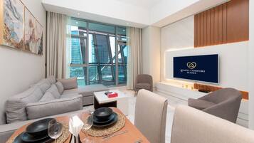 Comfort Apartment, 1 Bedroom | Living area | 50-inch Smart TV with cable channels, Netflix, streaming services