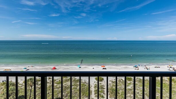 A beach with clear skies and calm waters. - OCEANFRONT condo directly overlooking the clear blue water of the Gulf of Mexico (Madeira Beach)