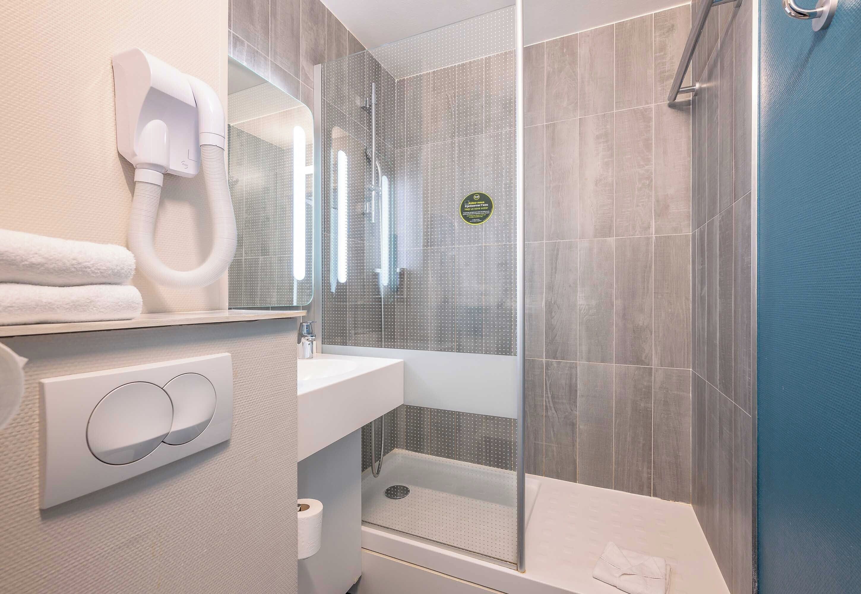 shower, towels, soap, toilet paper