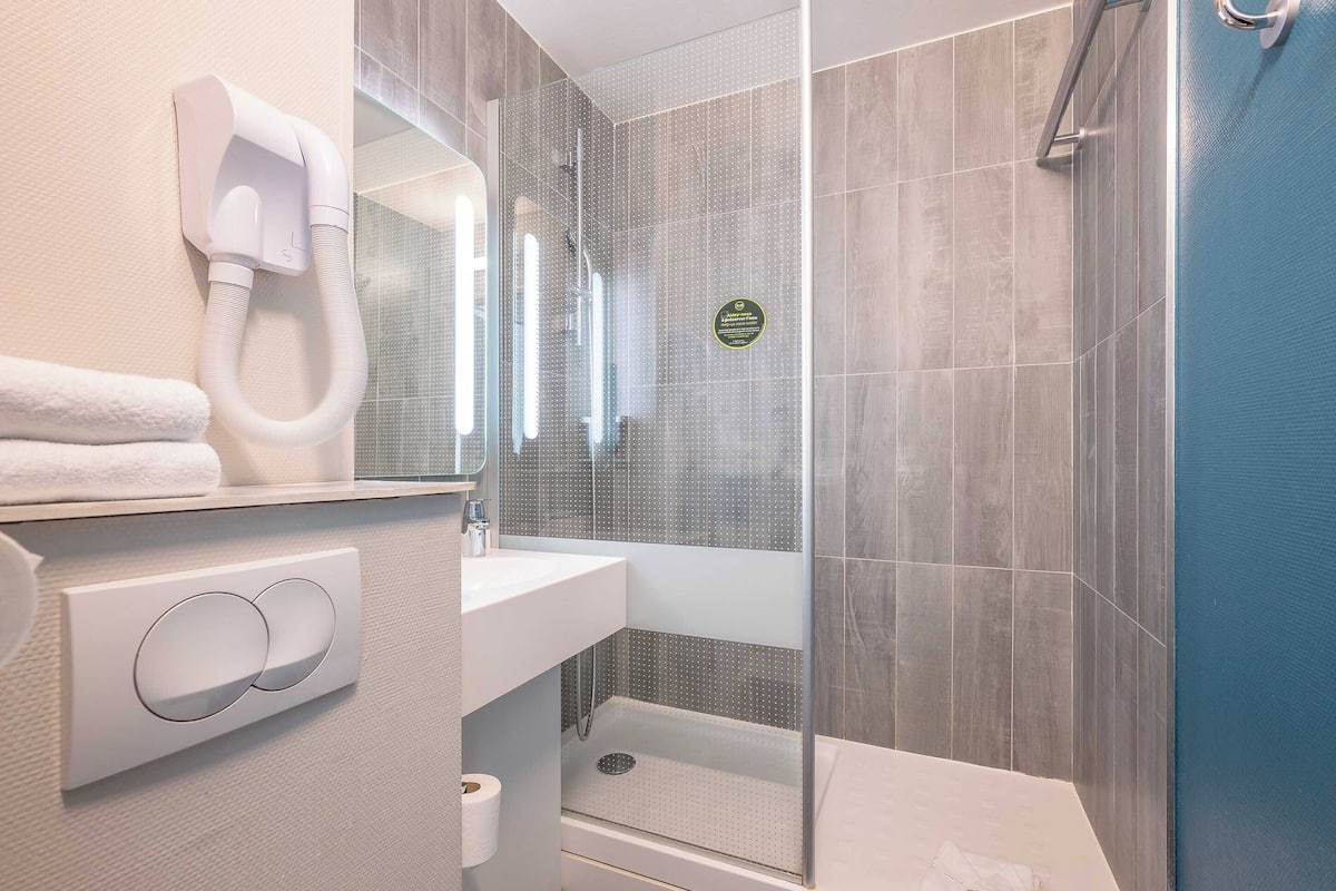 shower, towels, soap, toilet paper