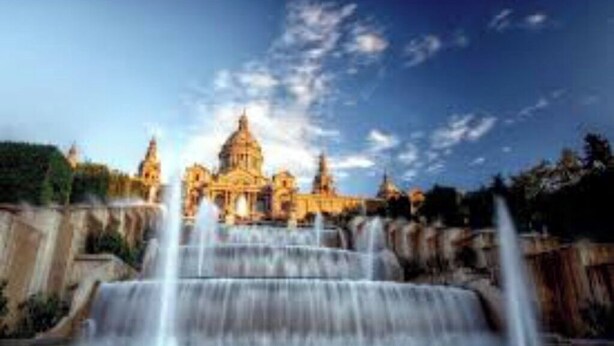 A large building with a central dome and multiple smaller domes, surrounded by a water feature with multiple waterfalls. - Welcoming apartment! (L'Hospitalet de Llobregat)