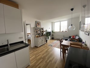 Enjoy a functional kitchen, dining area, and living space in this well-designed apartment.