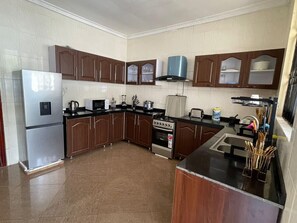 Apartment, Multiple Beds | Private kitchen | Fridge, microwave, oven, stovetop - Immaculate 3-bed Apartment in Dar es Salaam (Dar es Salaam)