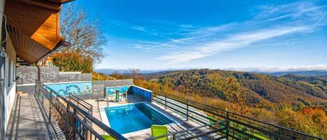 A heated pool, pool loungers