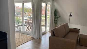 Superior Apartment | Living area | 36-inch Smart TV with cable channels