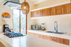 Fridge, microwave, stovetop, coffee/tea maker