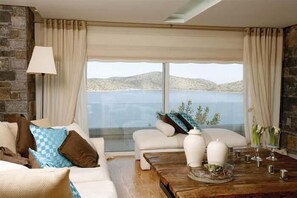 TV, fireplace - Villa Atlantis sea view villa with a heated pool (Elounda)
