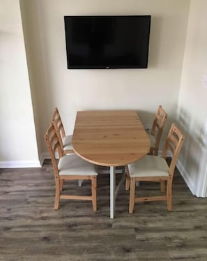 Enjoy meals in this dining area with a large table and comfortable chairs.