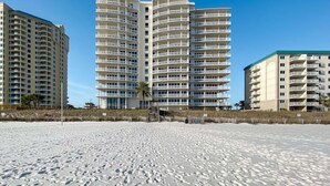 A beachfront hotel with multiple floors, balconies, and a sandy beach in the foreground. - La Playa 1101 Luxury Perdido Key Condo, Breathtaking Views (Pensacola)