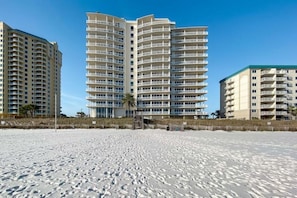 A beachfront hotel with multiple floors, balconies, and a sandy beach in the foreground. - La Playa 1101 Luxury Perdido Key Condo, Breathtaking Views (Pensacola)