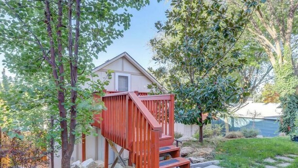 A wooden deck with a staircase leading to a small house. - Private Loft with trail access to Boise Foothills - Pets Welcome! (Boise)