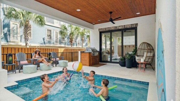 A swimming pool area with a wooden ceiling, a ceiling fan, and outdoor seating. - ✨ Summer Lane | Golf Cart | Heated Private Pool*  & Walk to Beach | Elevator | FREE Parasailing (Santa Rosa Beach)