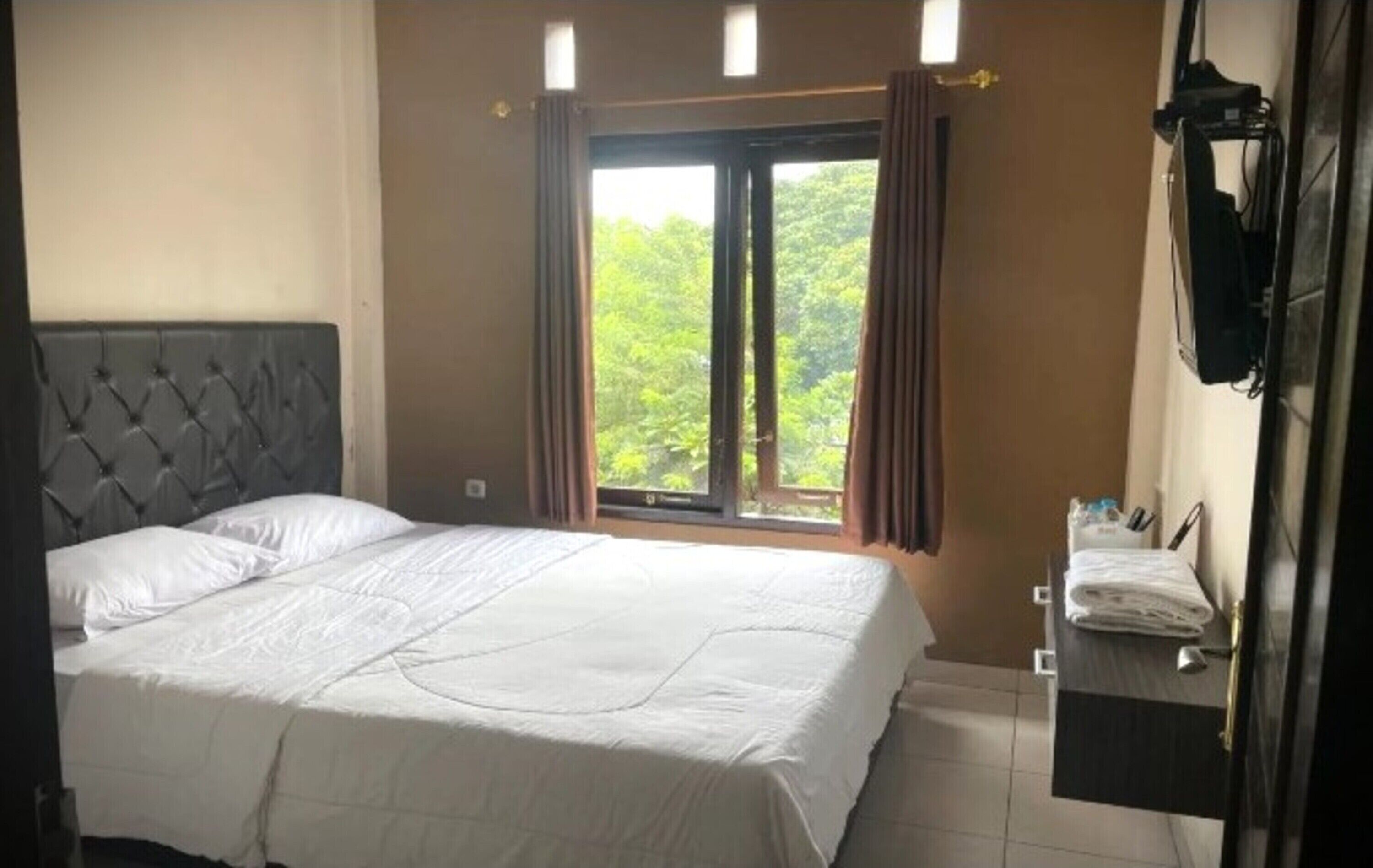 Kamar Deluks, Bebas Asap Rokok | Wi-Fi gratis dan seprai linen