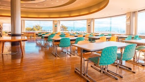 A spacious dining area with high tables and chairs, large windows offering a view of the outdoors, and a modern ceiling design. - Chateraise Hotel Nirasaki Forest (Nirasaki)
