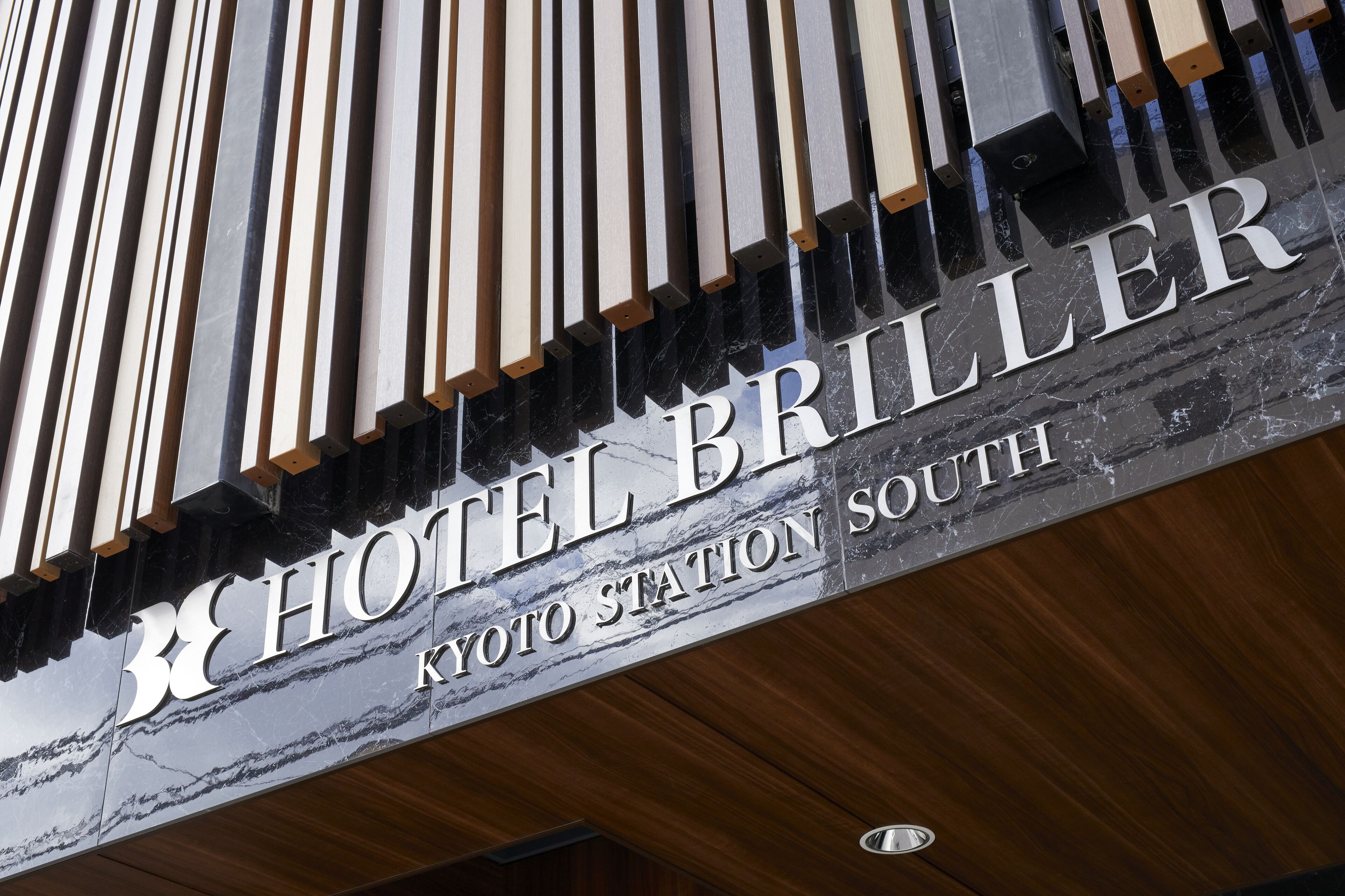 A sign for Hotel Briller at Kyoto Station South.